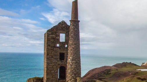 Botallack Mine sitting on the cliffs with the sea behind it near St Just in Cornwall